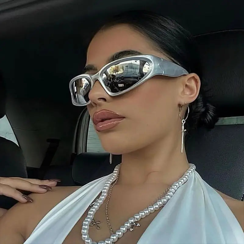 female model wearing silver y2k sunglasses